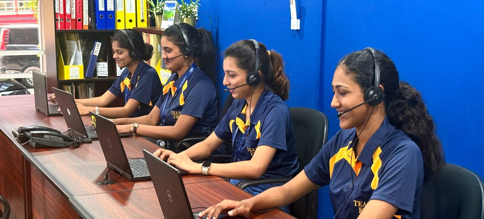 Family Movers operations team on headsets at their desks